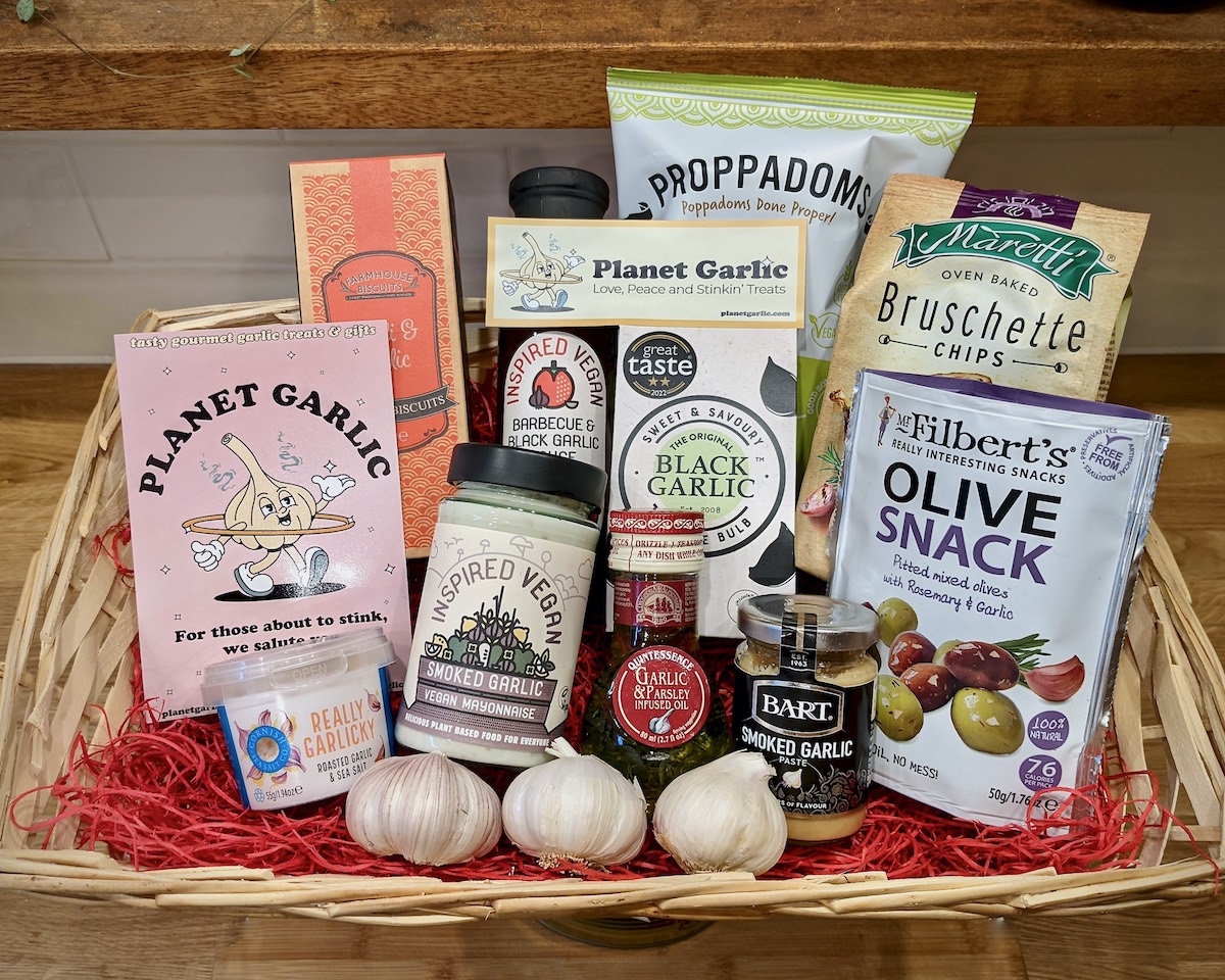 A gift hamper filled with garlic snacks and garlic cooking ingredients